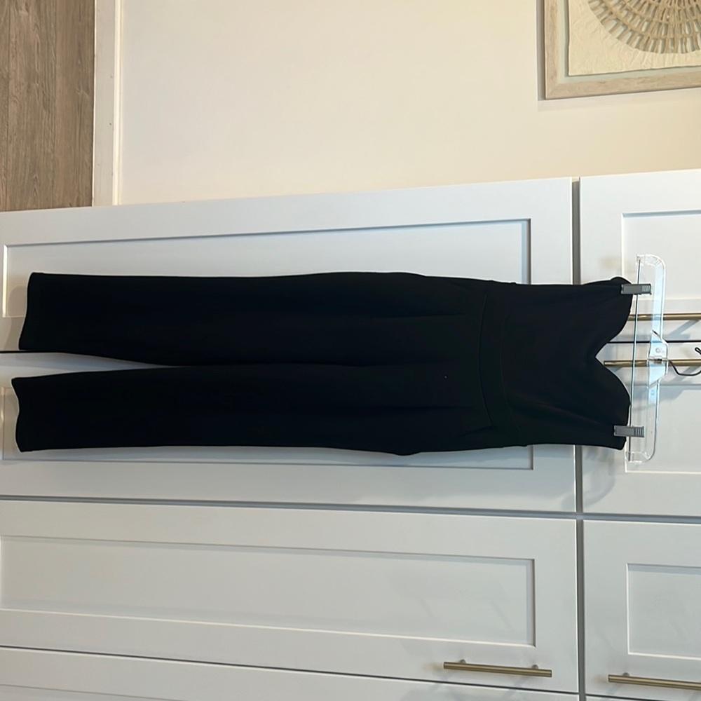 Black strapless jumpsuit with pockets.